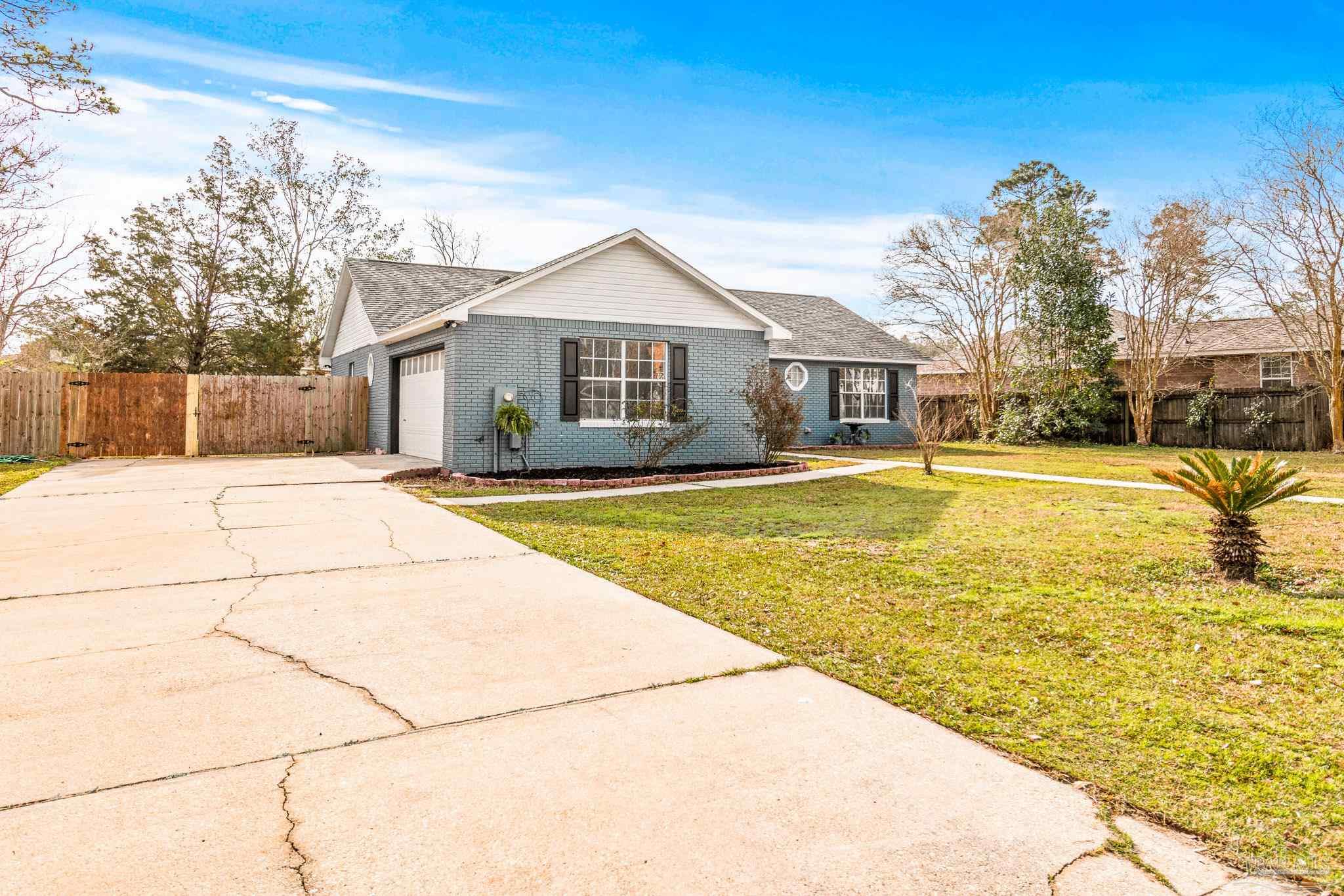1655 Eagle Terrace Cantonment, FL 32533 - Photo 47 of 47 a front view of house with yard and trees around