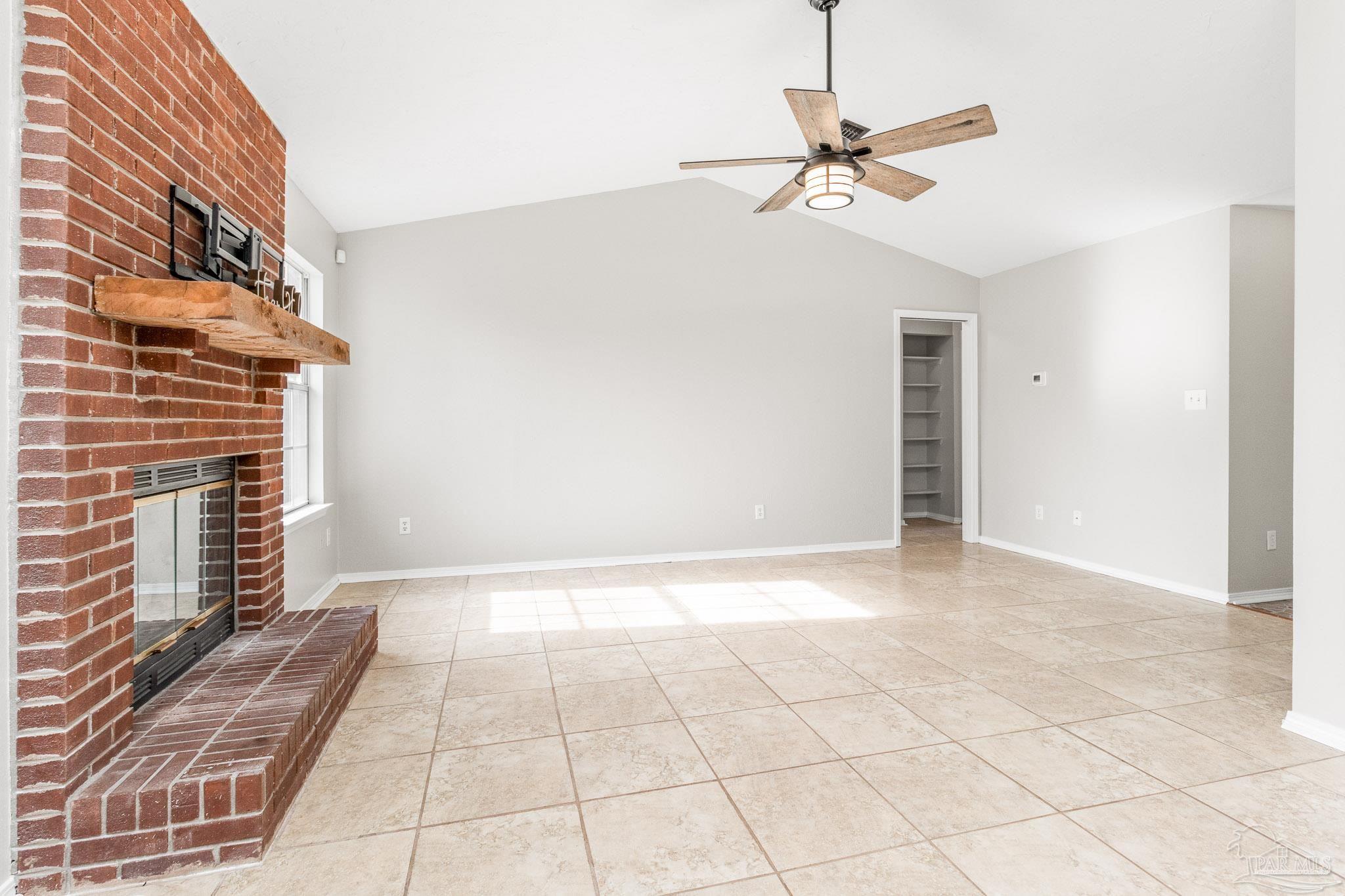 1655 Eagle Terrace Cantonment, FL 32533 - Photo 8 of 47 a view of a livingroom with a ceiling fan and window