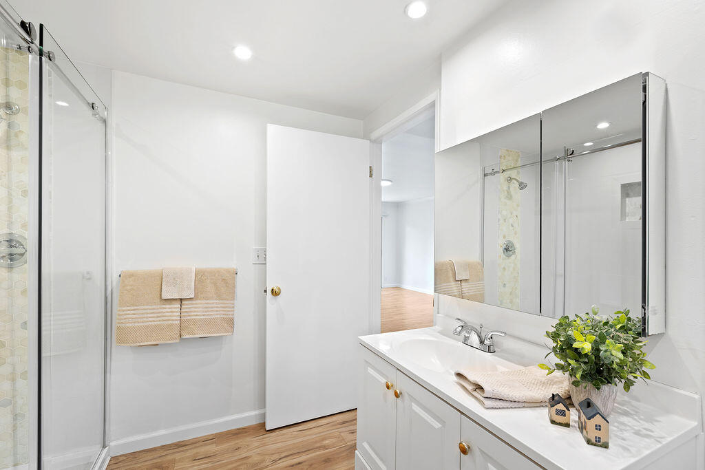 5722 Encina Road, Unit 2 Goleta, CA 93117 - Photo 11 of 21 a bathroom with a sink mirror and a shower