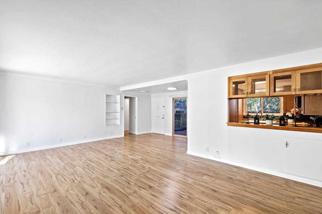 5722 Encina Road, Unit 2 Goleta, CA 93117 - Photo 3 of 21 a view of empty room with wooden floor and fan