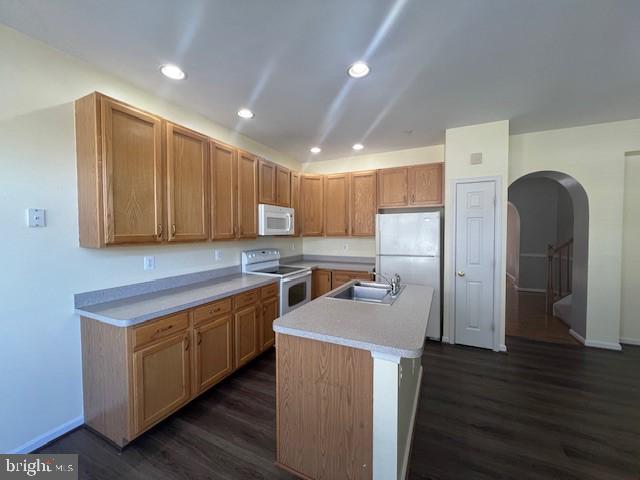 2622 Mill Race Road Frederick, MD 21701 - Photo 7 of 23 a kitchen with stainless steel appliances granite countertop a refrigerator a sink a stove and oven with wooden floor