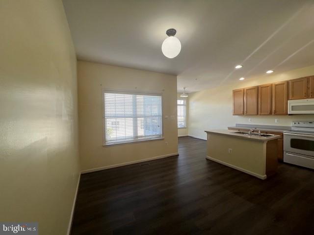 2622 Mill Race Road Frederick, MD 21701 - Photo 8 of 23 a kitchen with stainless steel appliances granite countertop a stove a sink white cabinets and a wooden floor