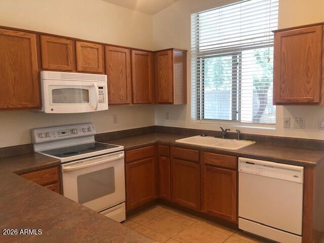 4044 West Hackamore Drive Phoenix, AZ 85083 - Photo 3 of 9 a kitchen with a sink stove and cabinets