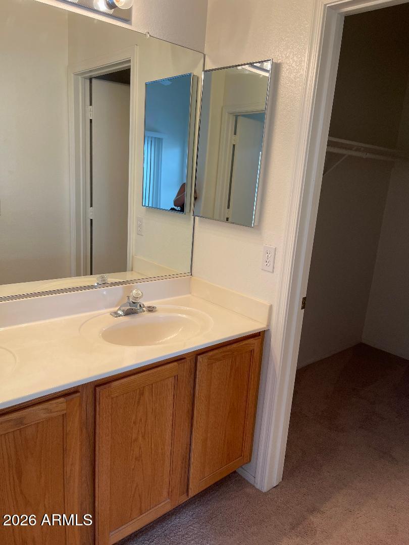 4044 West Hackamore Drive Phoenix, AZ 85083 - Photo 7 of 9 a bathroom with a sink and a mirror