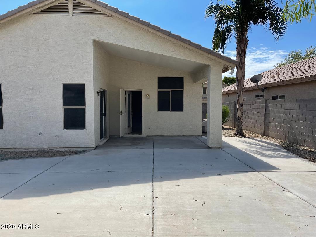 4044 West Hackamore Drive Phoenix, AZ 85083 - Photo 9 of 9 a house with a yard and a garage