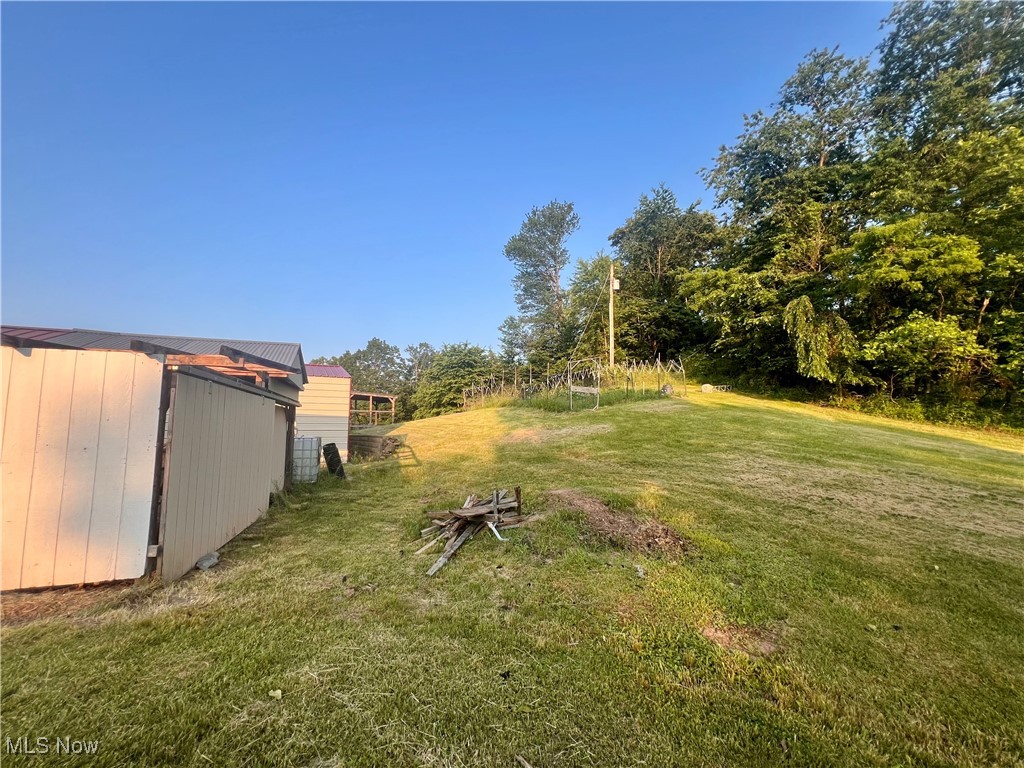 8548 Mount Carmel Rdg Road St. Marys, WV 26170 - Photo 9 of 30 View of green lawn featuring an outbuilding/wood shed