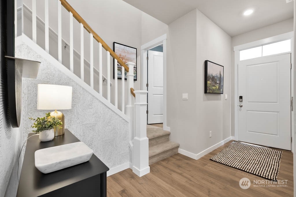 4426 228th Place South East, Unit MC2 Bothell, WA 98021 - Photo 2 of 30 a view of an entryway with wooden floor and windows