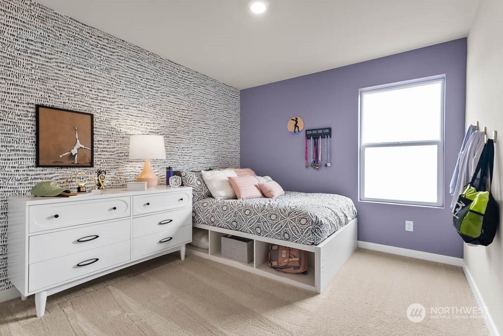 4426 228th Place South East, Unit MC2 Bothell, WA 98021 - Photo 27 of 30 a spacious bedroom with a bed and a dresser
