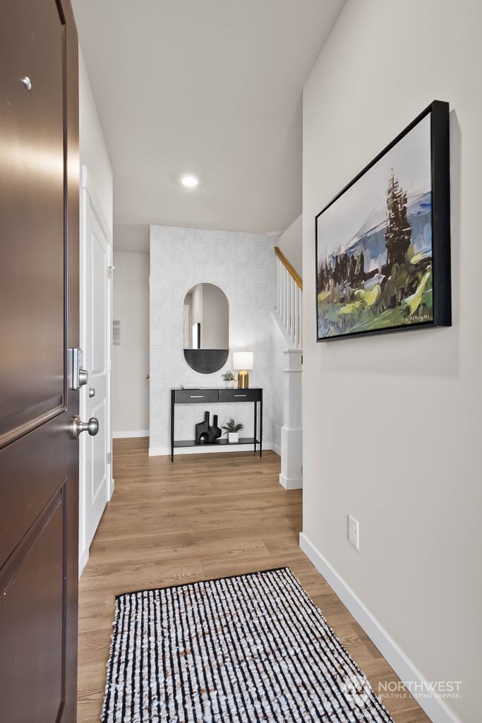 4426 228th Place South East, Unit MC2 Bothell, WA 98021 - Photo 3 of 30 a living room with a couch and a painting on the wall