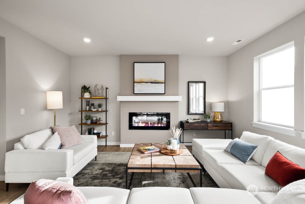 4426 228th Place South East, Unit MC2 Bothell, WA 98021 - Photo 6 of 30 a living room with furniture and a fireplace