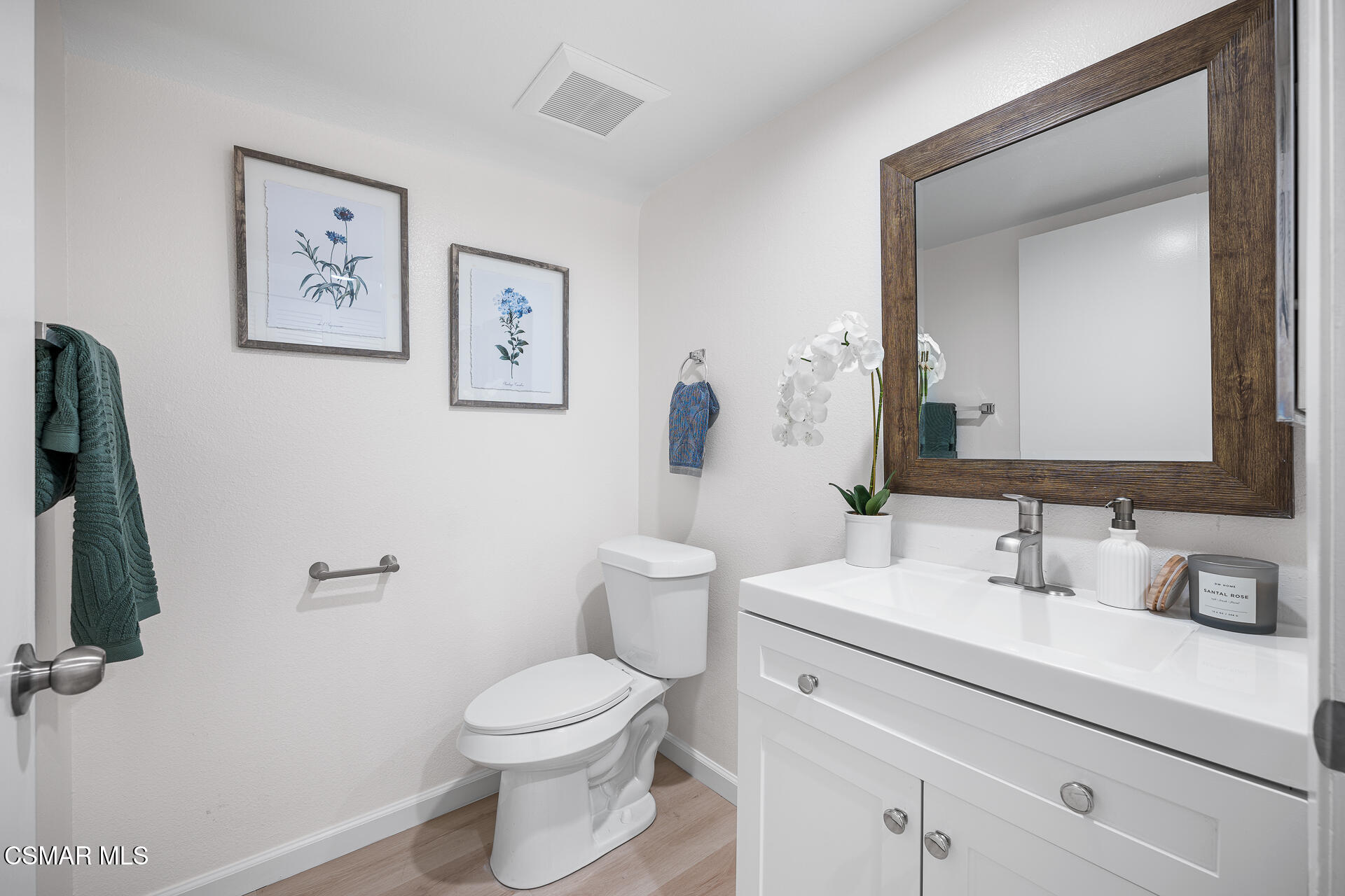 577 Spring Road, Unit 54 Moorpark, CA 93021 - Photo 11 of 23 a bathroom with a toilet sink and mirror