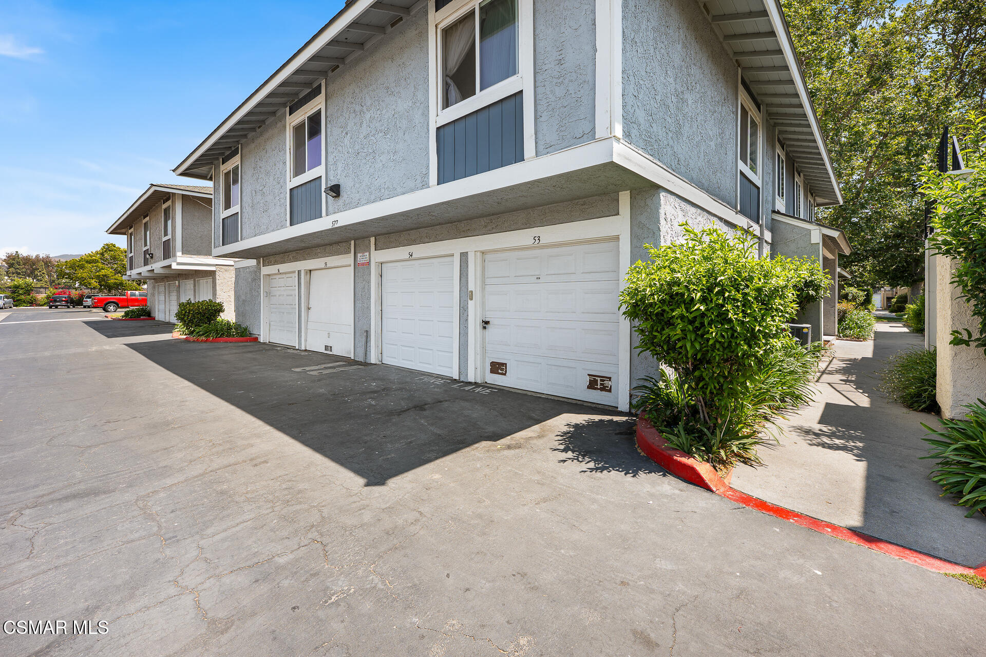 577 Spring Road, Unit 54 Moorpark, CA 93021 - Photo 2 of 23 a view of a street with buildings