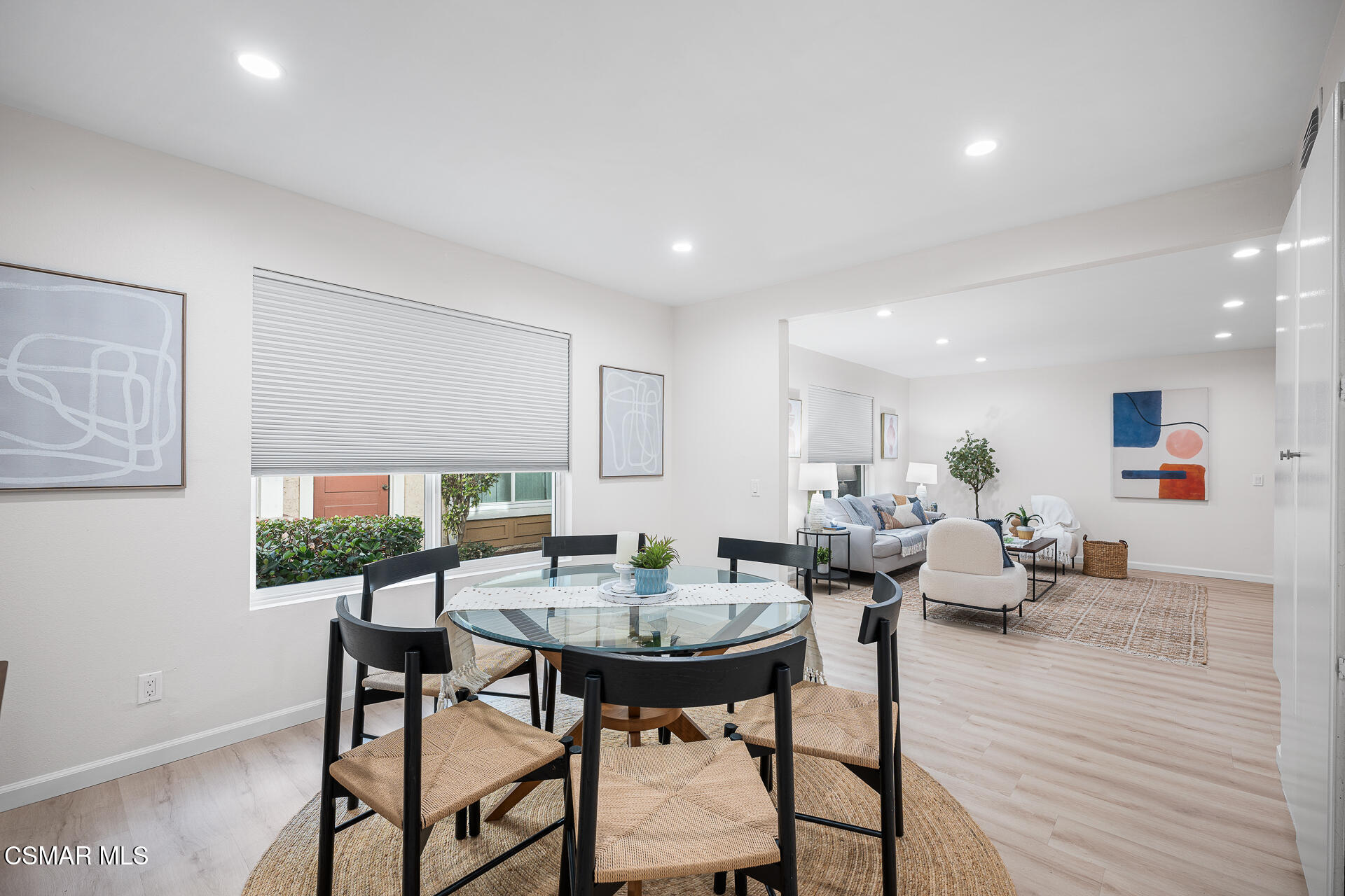 577 Spring Road, Unit 54 Moorpark, CA 93021 - Photo 8 of 23 a view of a dining room with furniture and wooden floor