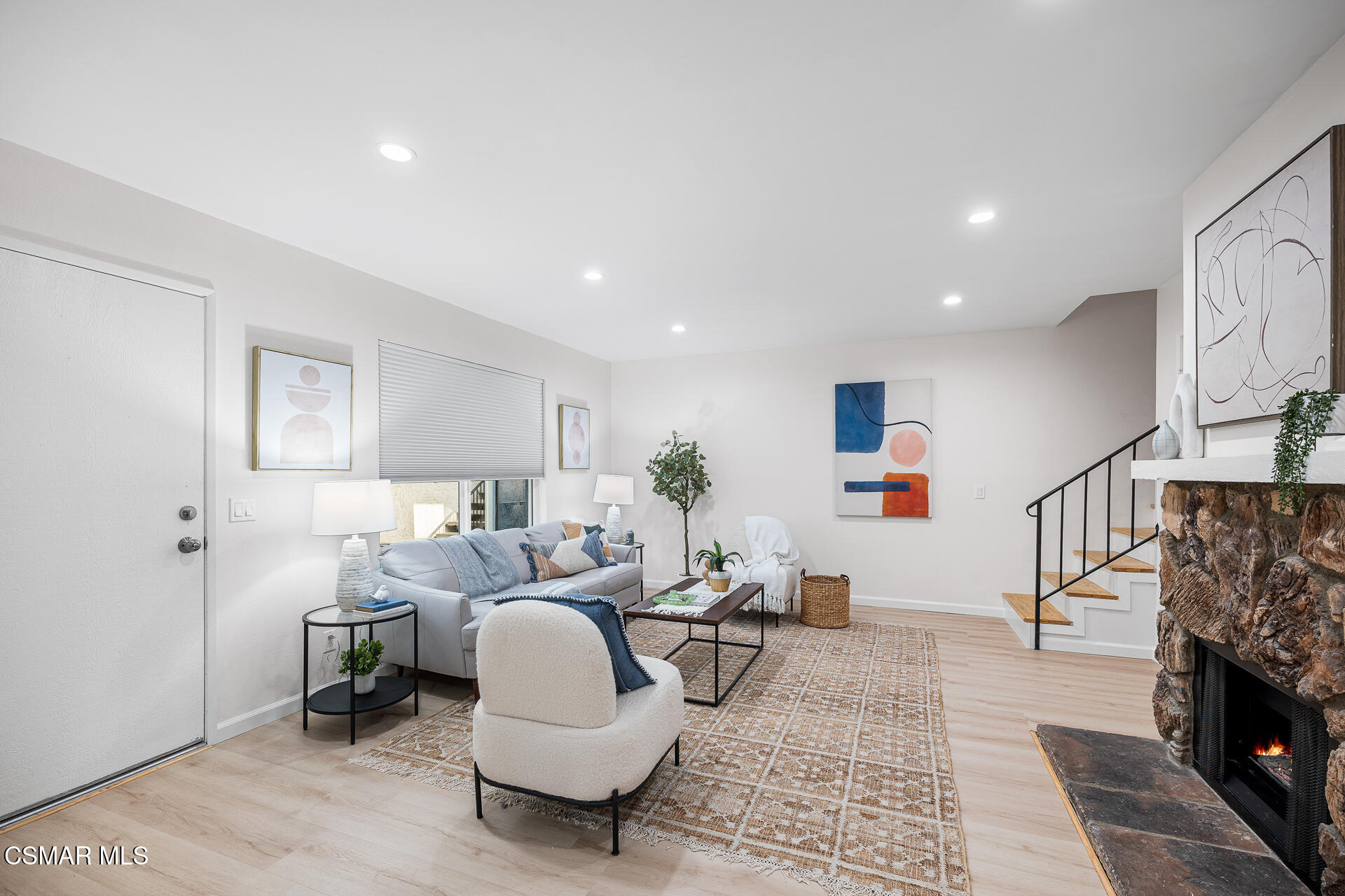 577 Spring Road, Unit 54 Moorpark, CA 93021 - Photo 9 of 23 a living room with furniture and a fireplace