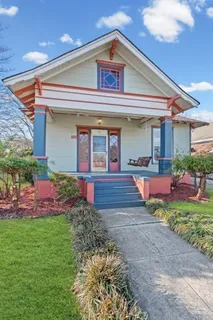 a front view of house with yard and outdoor seating