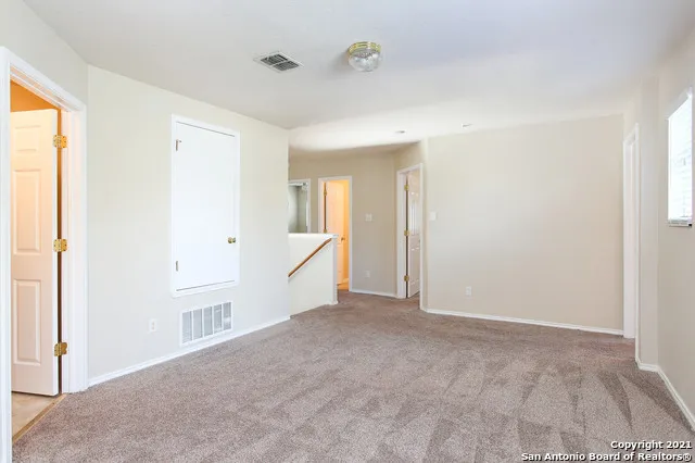 a view of an empty room and window