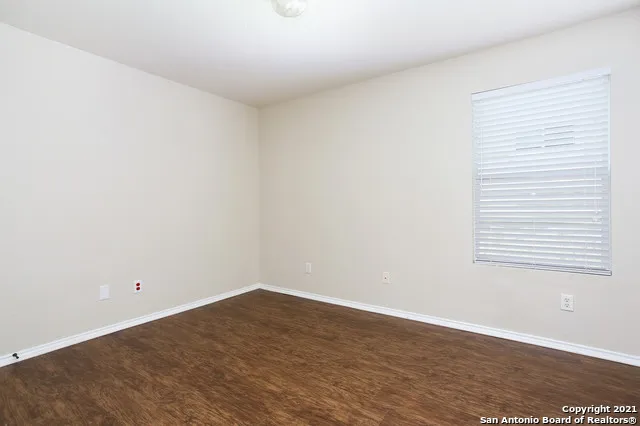 a view of a room that has a window in it