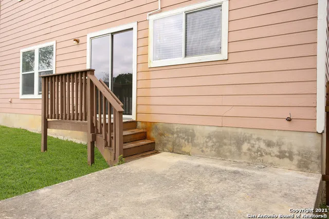 a view of a porch with a bench