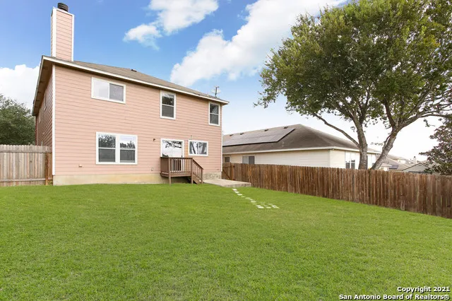 a view of a backyard of the house