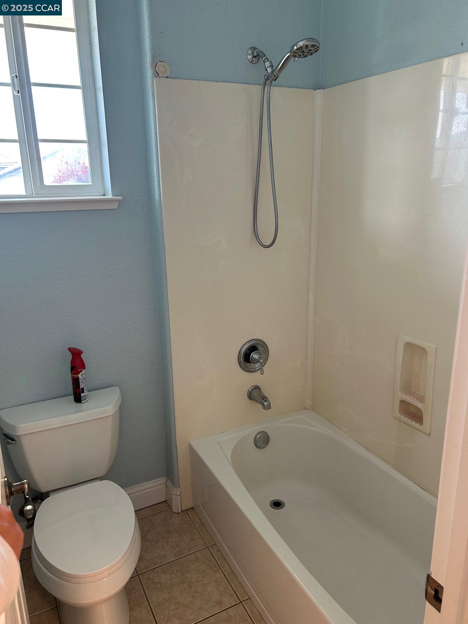 1849 Alexander Way Brentwood, CA 94513 - Photo 25 of 38 a white toilet sitting next to a bath tub shower