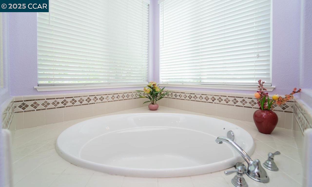 1849 Alexander Way Brentwood, CA 94513 - Photo 32 of 38 a bathroom with a tub and shower