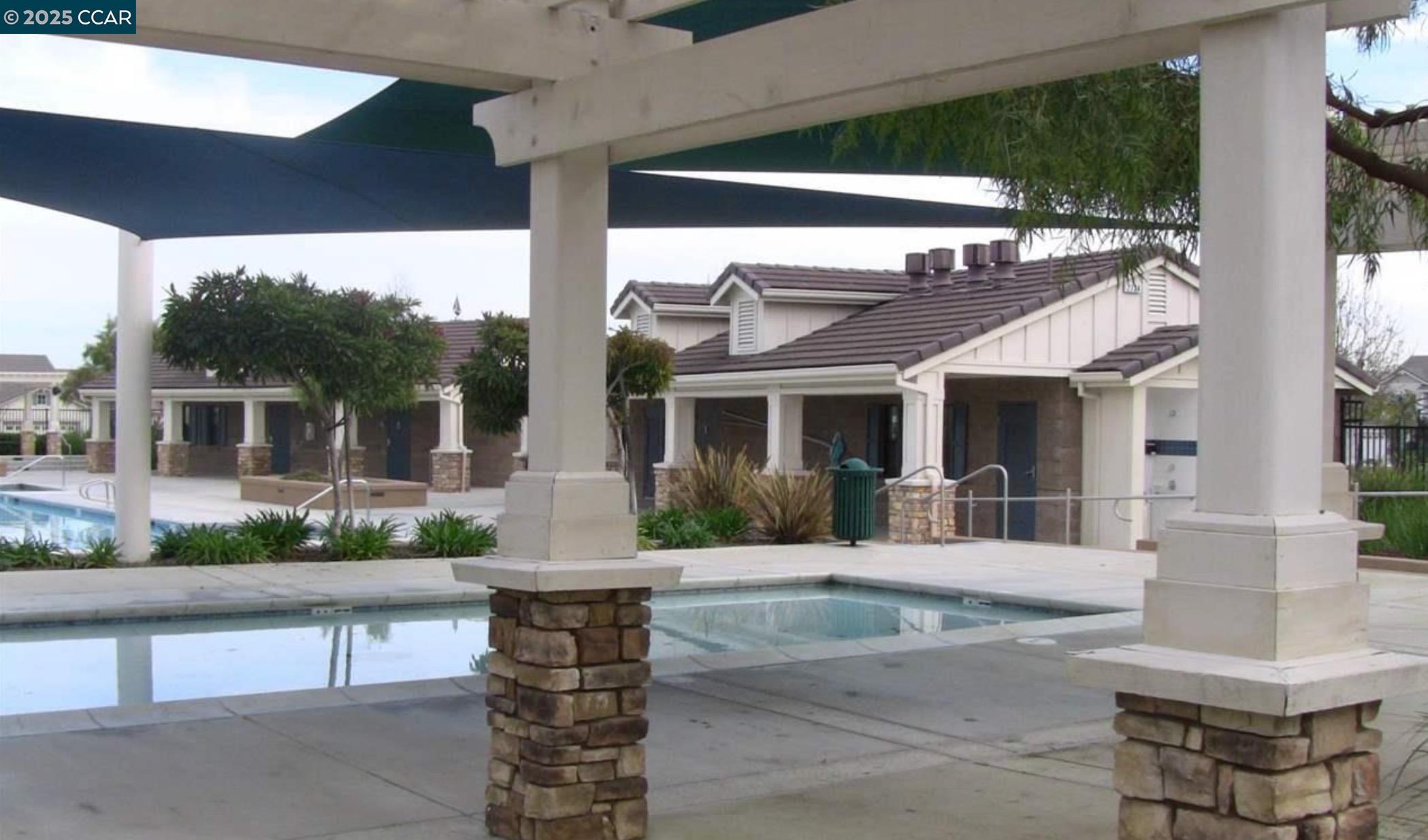 1849 Alexander Way Brentwood, CA 94513 - Photo 37 of 38 a front view of a house with fountain and dining area
