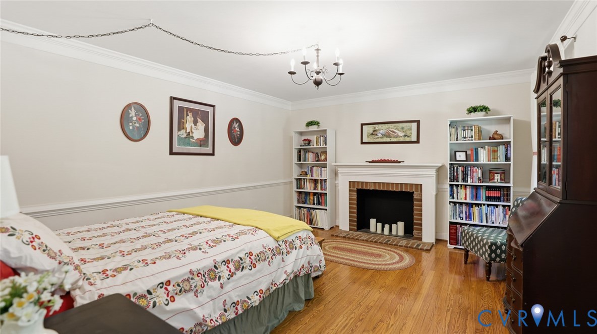 10716 Chalkley Road Richmond, VA 23237 - Photo 12 of 46 a bedroom with a bed and a fireplace