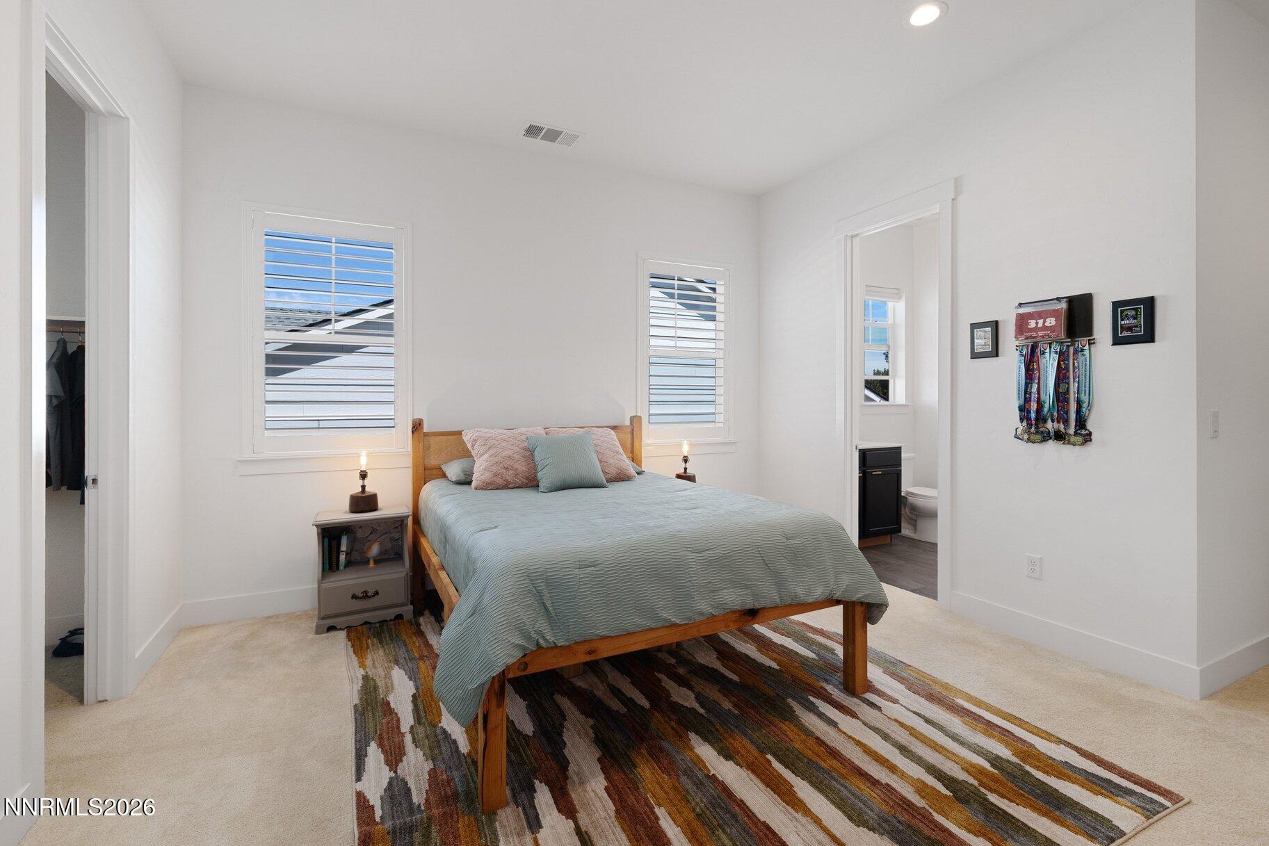 6110 South Pleasant Oak Trail Reno, NV 89511 - Photo 32 of 66 a bedroom with a bed and a window