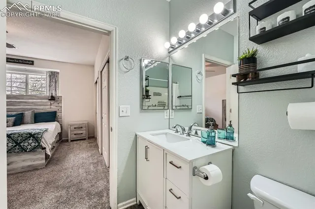 a spacious bathroom with a sink double vanity and a mirror