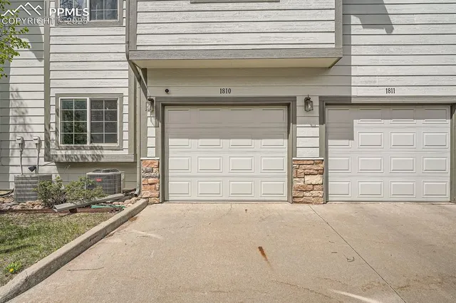a front view of a house with garage