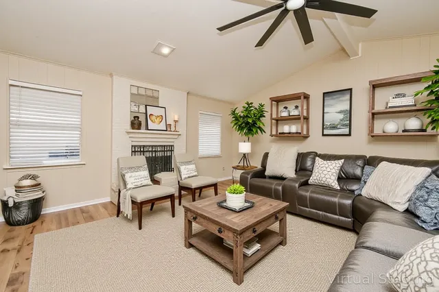 a kitchen with sink cabinets and wooden floor