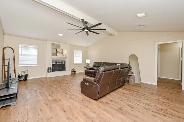 a bedroom with a bed and a flat screen tv in it