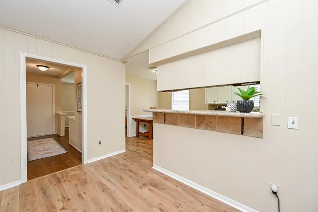 a bedroom with a bed and a ceiling fan