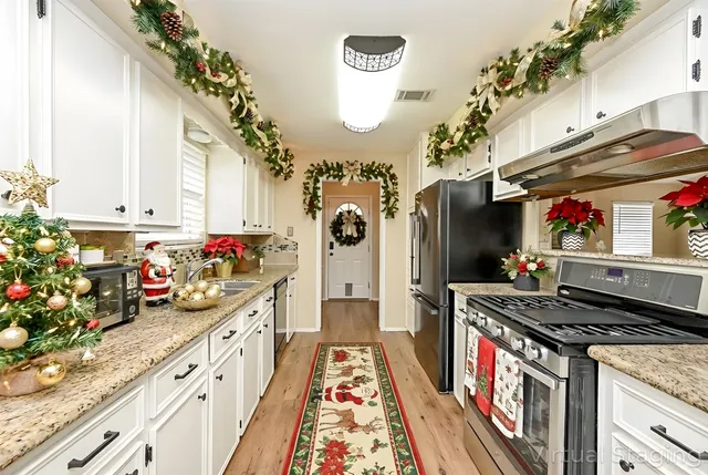 a kitchen with stove and flowers