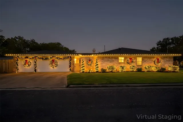 a front view of a house with a swimming pool