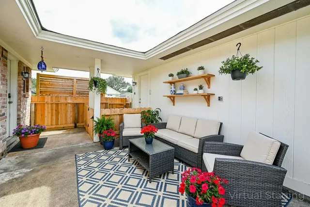 a view of a kitchen with sink and wooden floor
