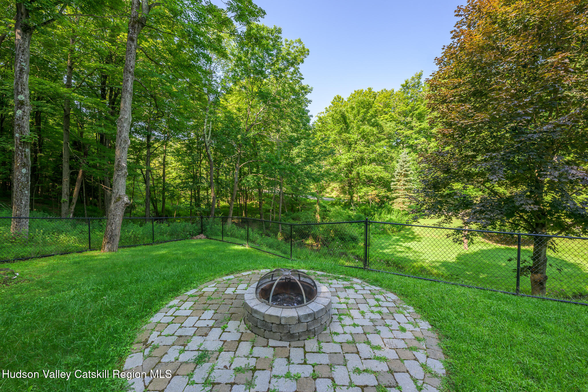 218 Decker Road Craryville, NY 12521 - Photo 17 of 21 a view of a backyard with a garden and outdoor seating