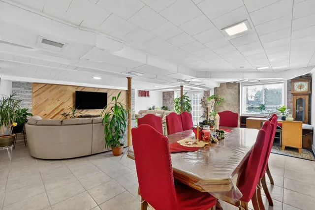a view of a dining room with furniture and a livingroom