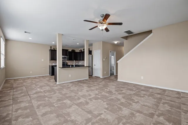 a view of a livingroom with a kitchen