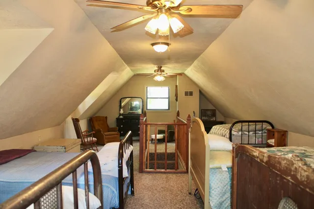 a view of hall way with furniture