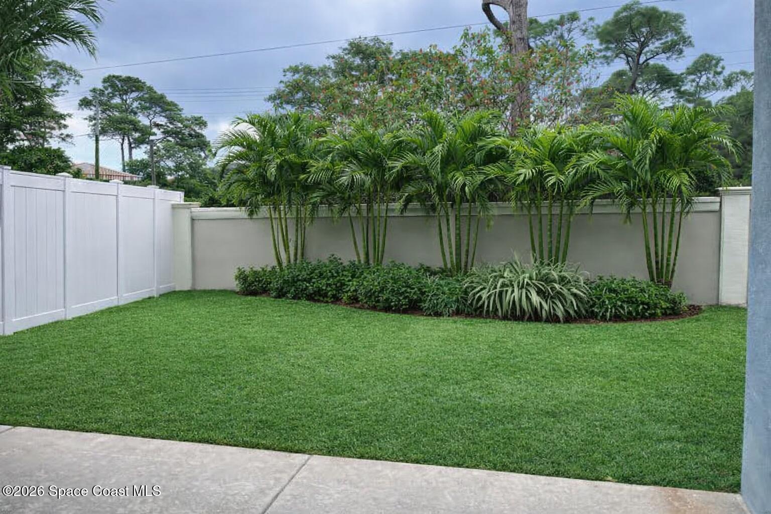 3629 Poseidon Way Indialantic, FL 32903 - Photo 2 of 2 a view of a backyard of a house