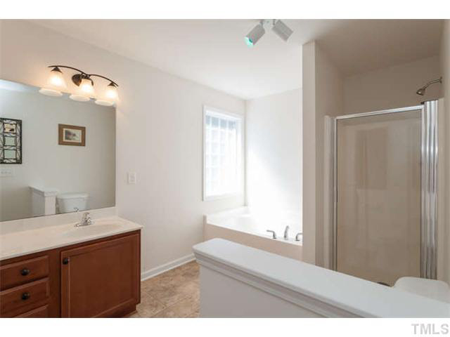 1413 Pattersons Mill Road Durham, NC 27703 - Photo 13 of 25 Large master bath with garden tub, dual sinks, and separate shower.