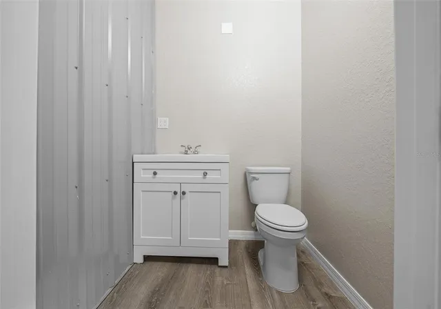 a view of a green field with clear sky