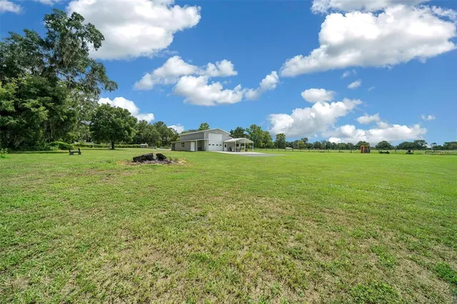 a view of a big yard with a house