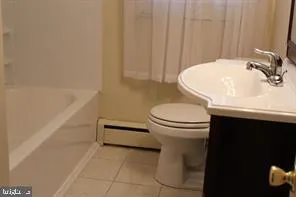 a bathroom with a sink a toilet and a tub