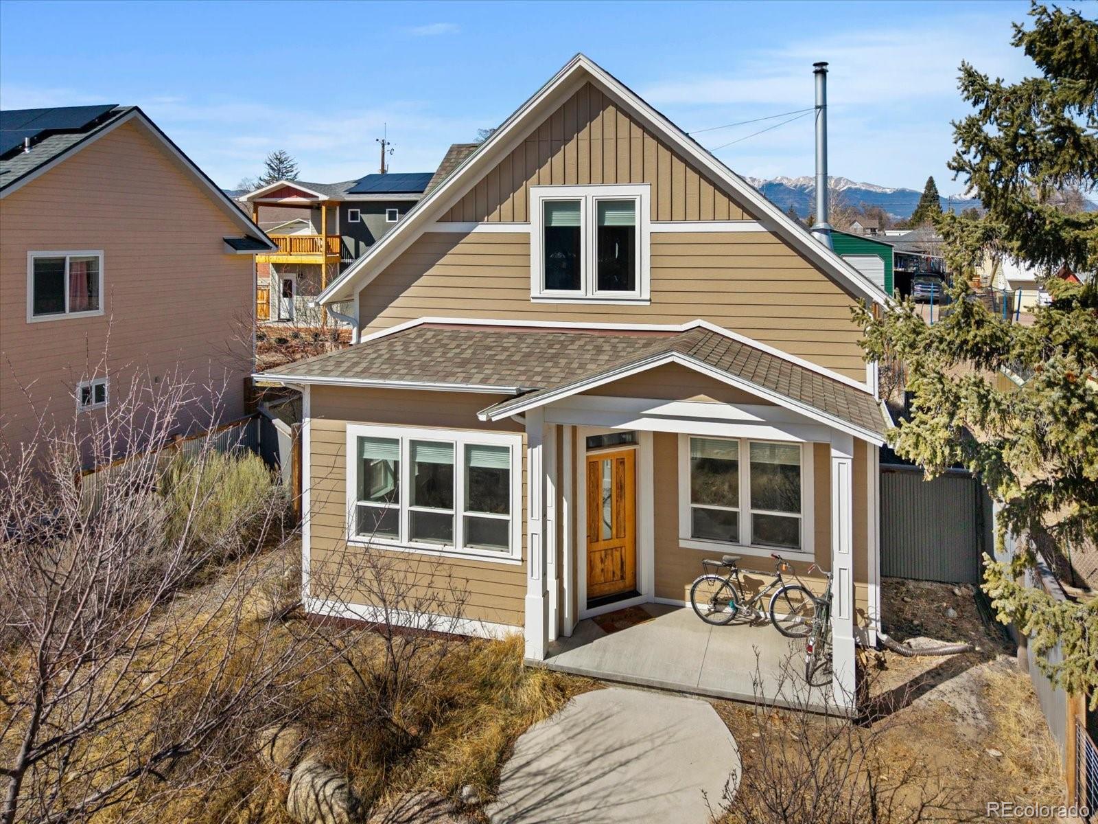 1208 E Street Salida, CO 81201 - Photo 1 of 50 a front view of a house with a yard