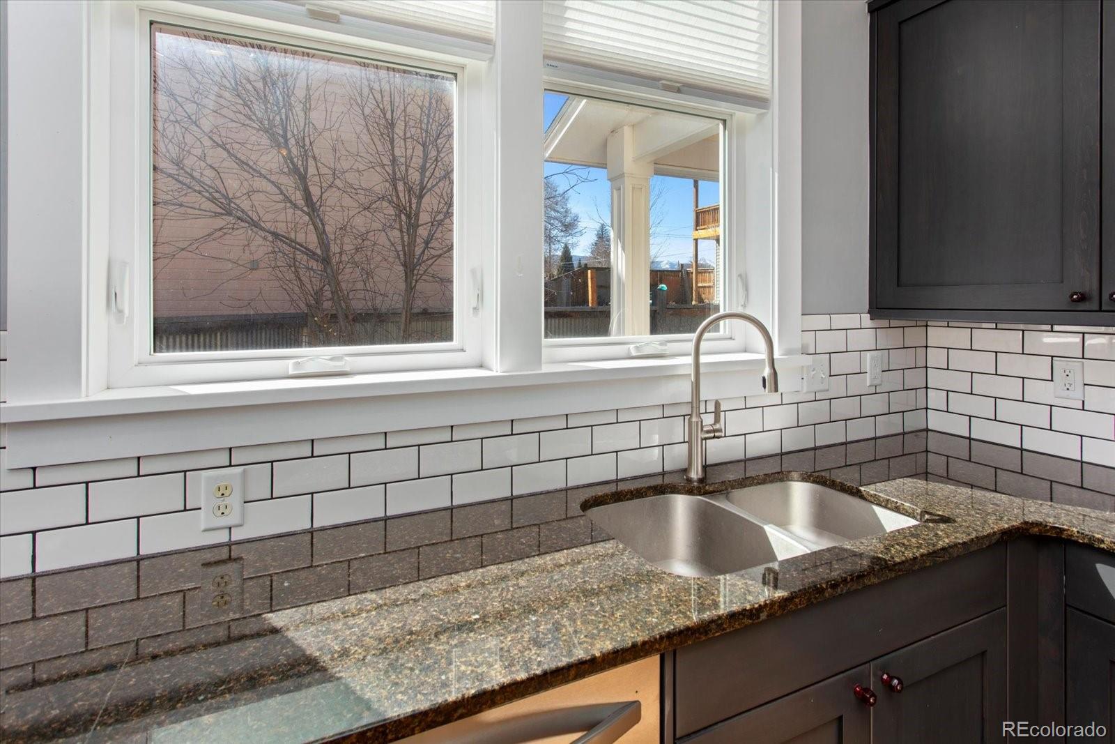 1208 E Street Salida, CO 81201 - Photo 15 of 50 a kitchen with a sink and cabinets