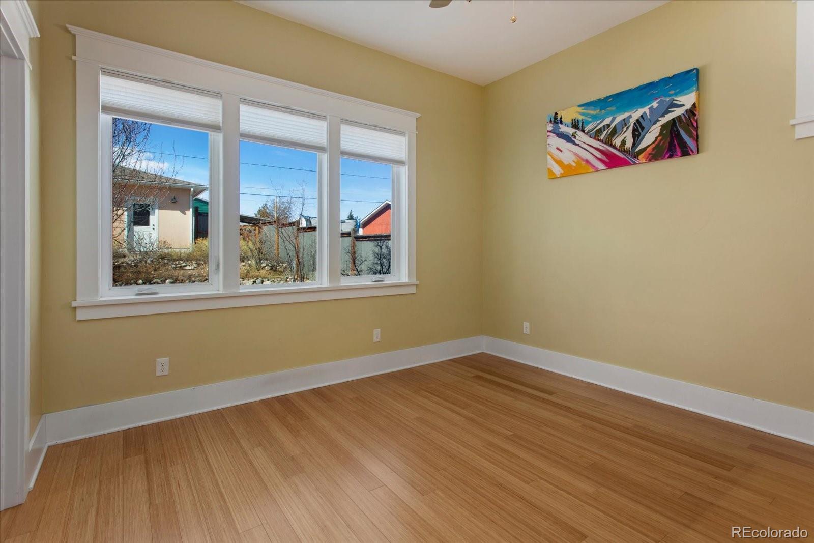 1208 E Street Salida, CO 81201 - Photo 17 of 50 a view of a room with wooden floor and window