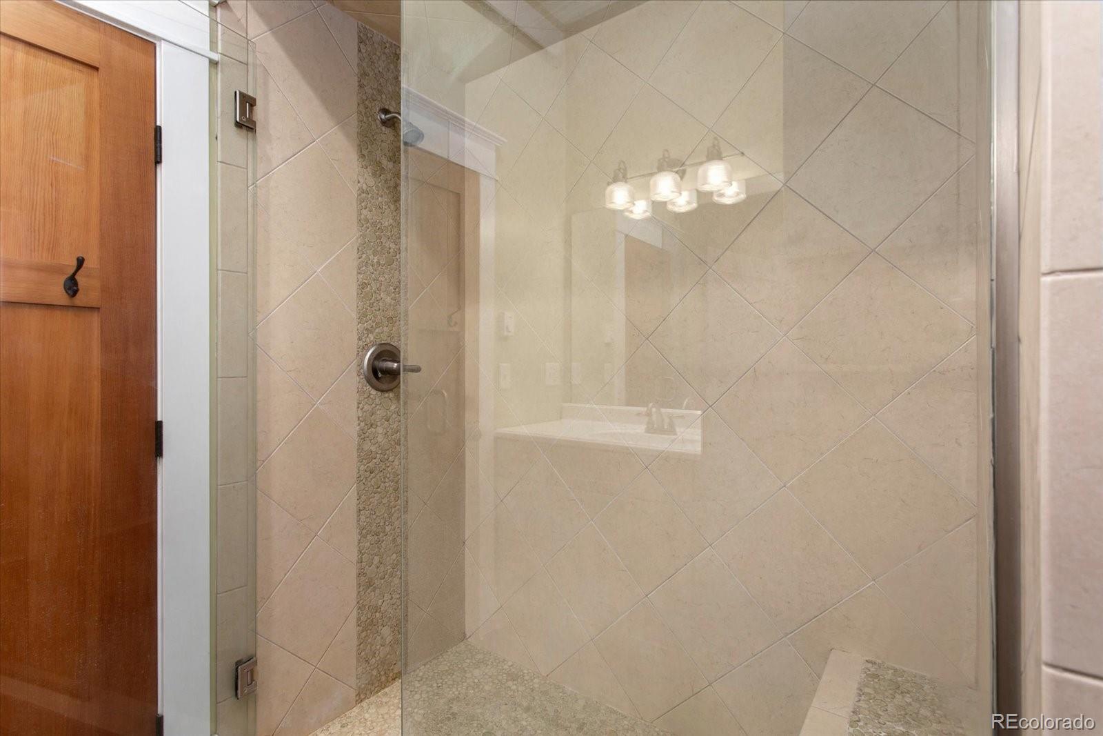 1208 E Street Salida, CO 81201 - Photo 19 of 50 a bathroom with a shower curtain and a shower curtain