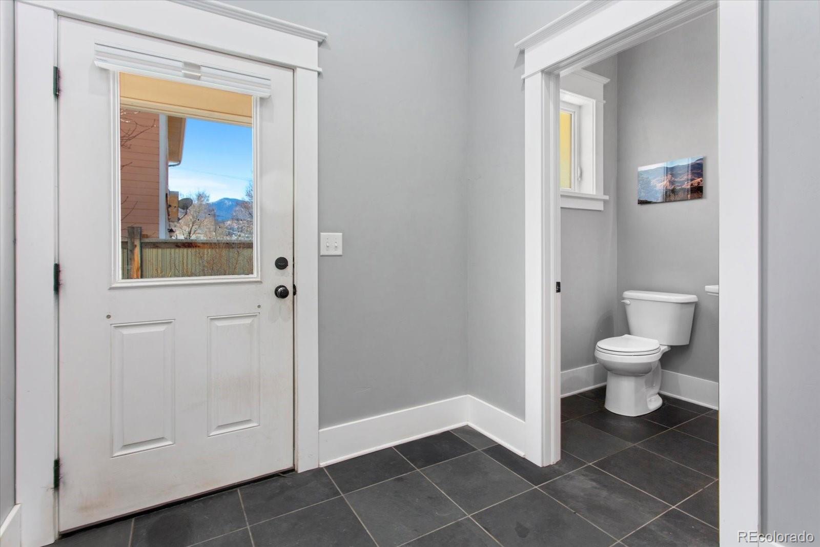 1208 E Street Salida, CO 81201 - Photo 21 of 50 a bathroom with a toilet and a sink